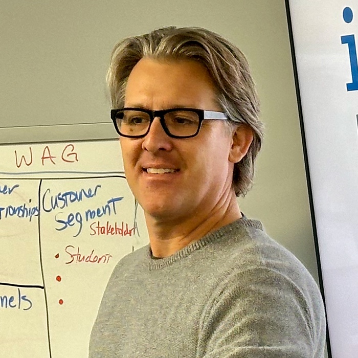 Chris Greene teaching the business-model canvas to students